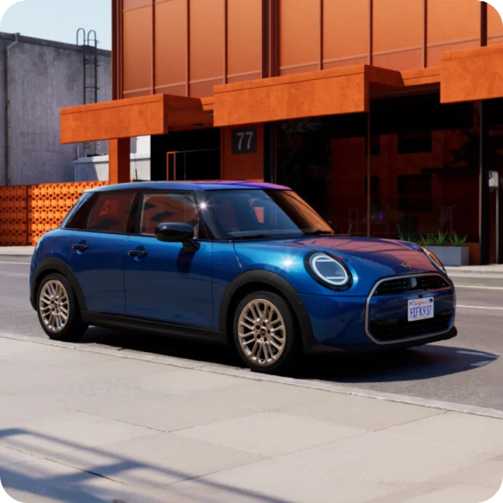 El MINI Cooper S 4 Puertas aparcado delante de un edificio naranja.