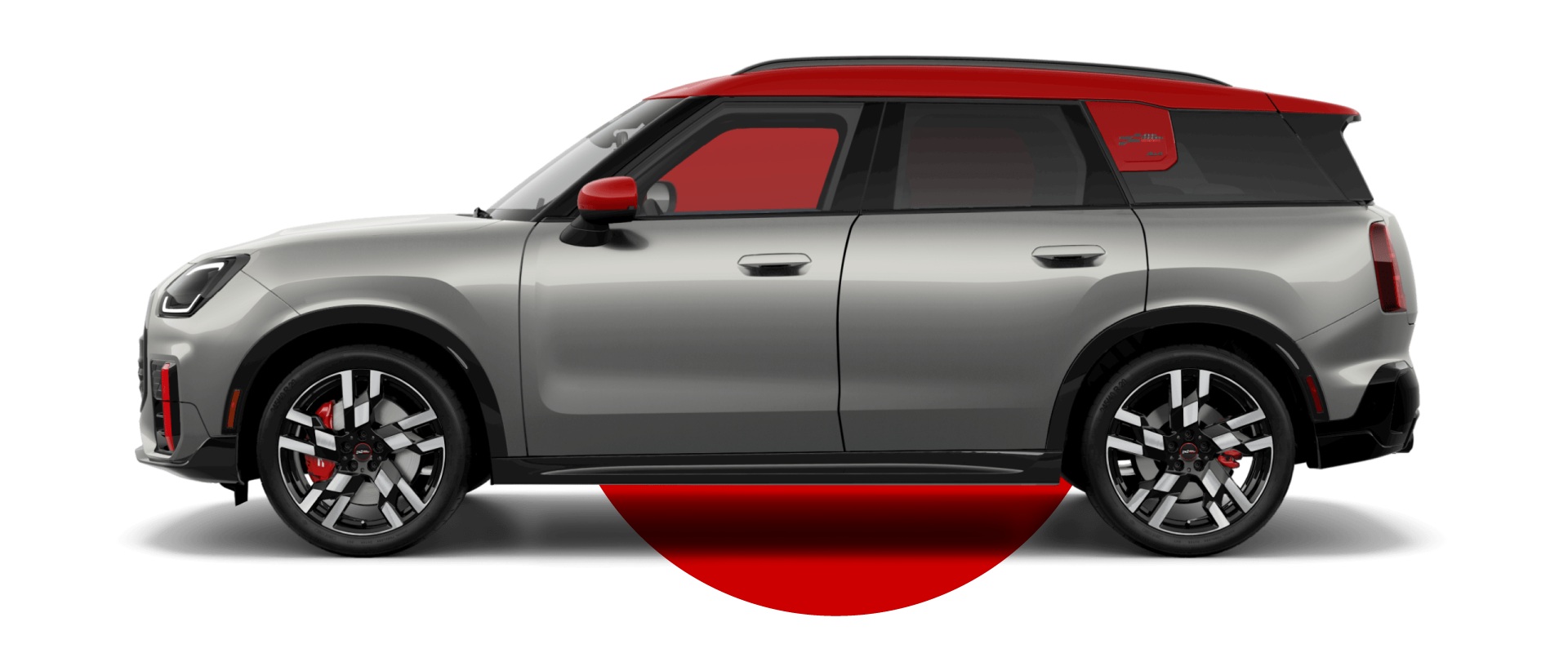 Vista lateral de un MINI JCW Countryman ALL4 en el color de carrocería Melting Silver III, mirando hacia la izquierda con su sombra debajo.